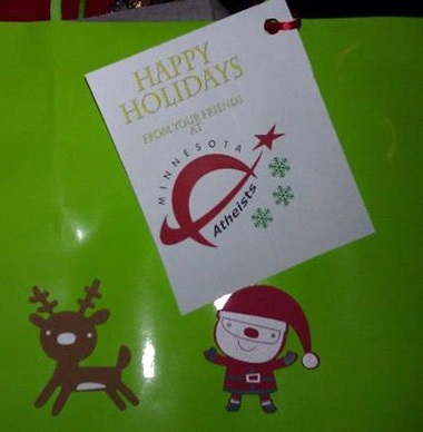 Photo of gift tag saying "Happy holidays from your friends at Minnesota Atheists."