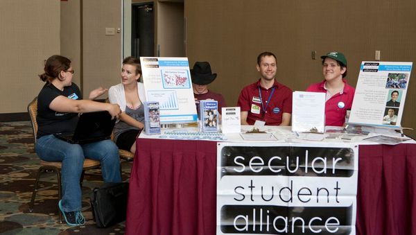 Photo of crowd around Secular Student Alliance table.