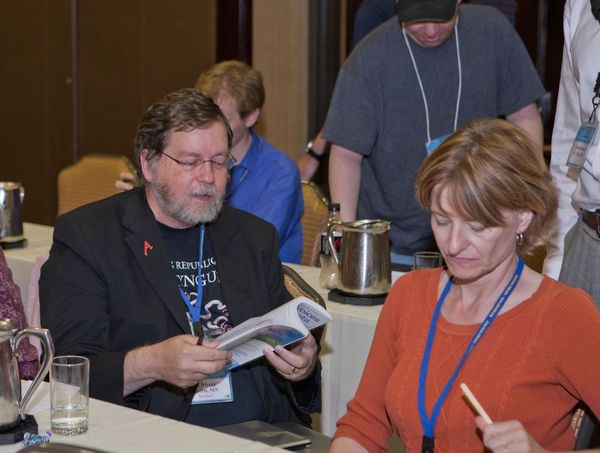 Photo of PZ Myers signing Atheist Voices of Minnesota.