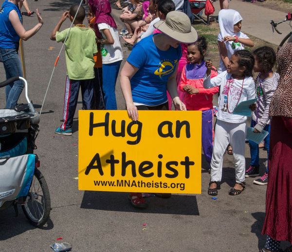 Photo of children collecting atheist hugs.