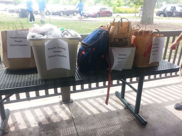 Photo of bags of school supplies donated.