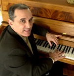 Photo of Dan Barker at a piano.